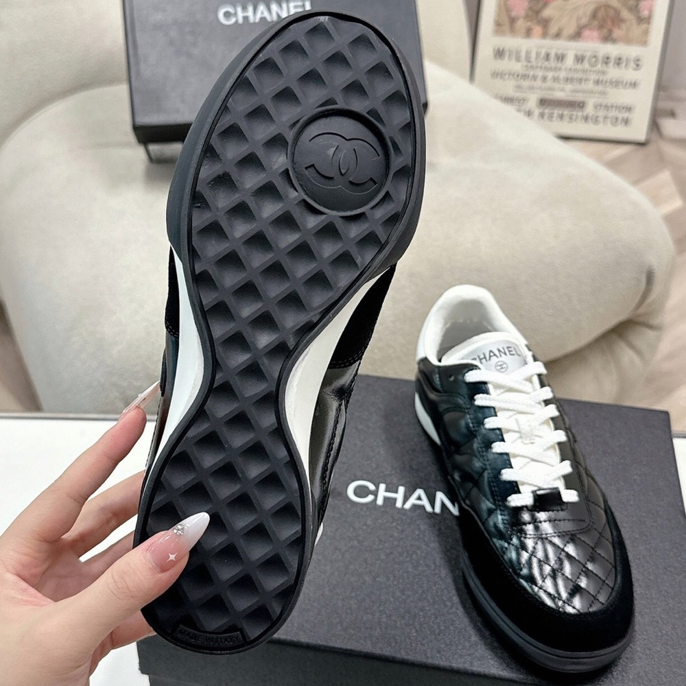 Women's Chanel Black Quilted Patent Leather White Lace-Up Sneakers - Picture 4 of 7